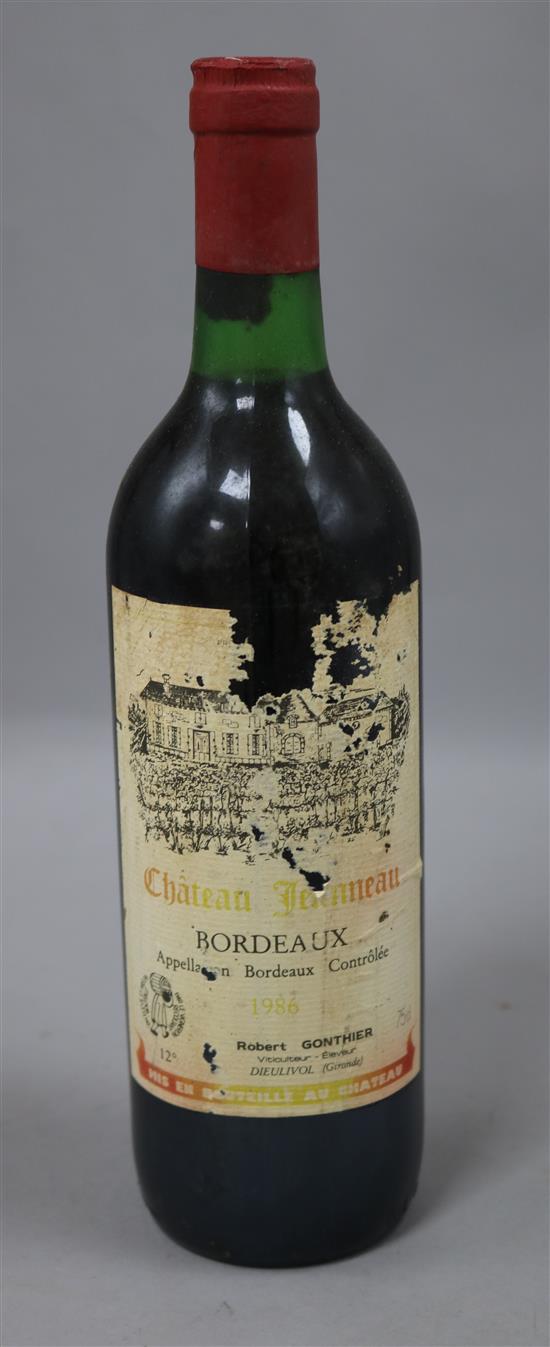 Twenty four bottles of Chateau Jeanneau, Bordeaux, 1986(23) & 1983(1).